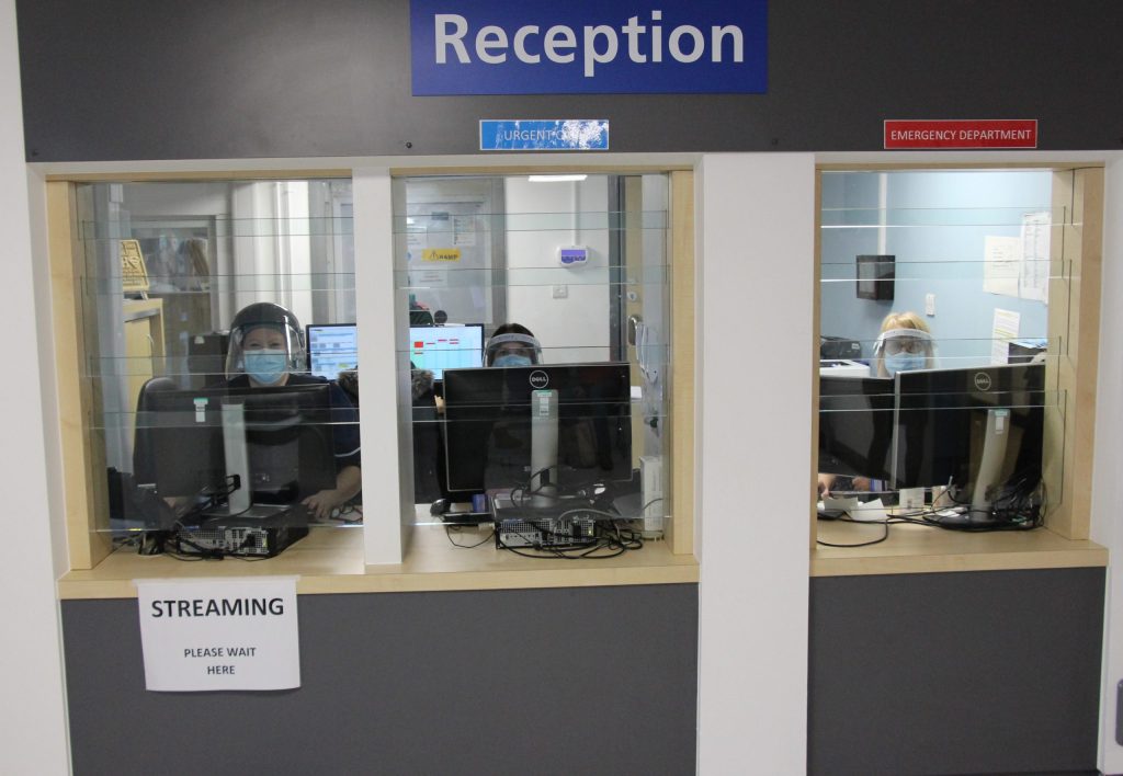 reception desk. It is behind a screen.