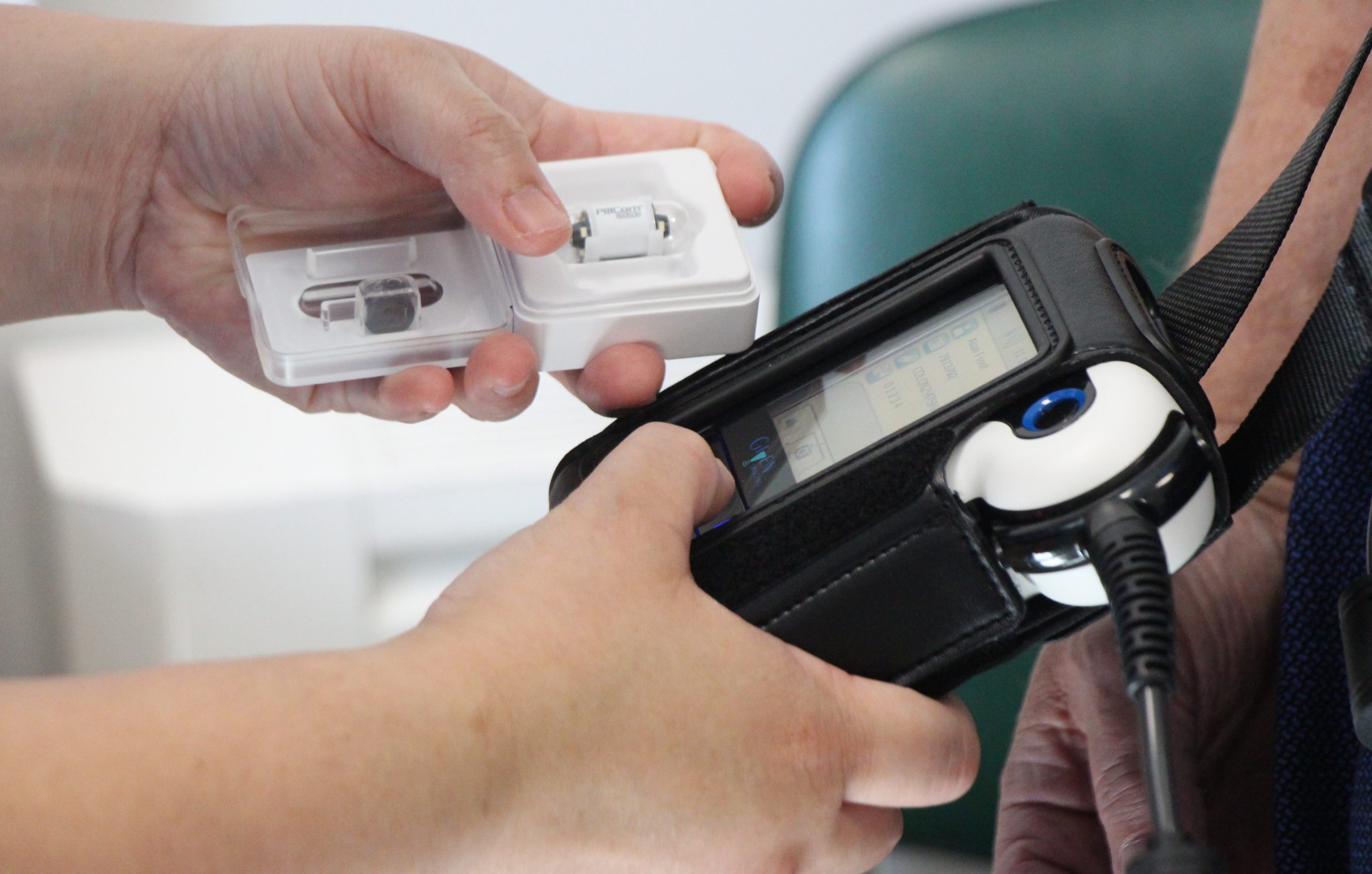 A nurse checks the the data recorder.