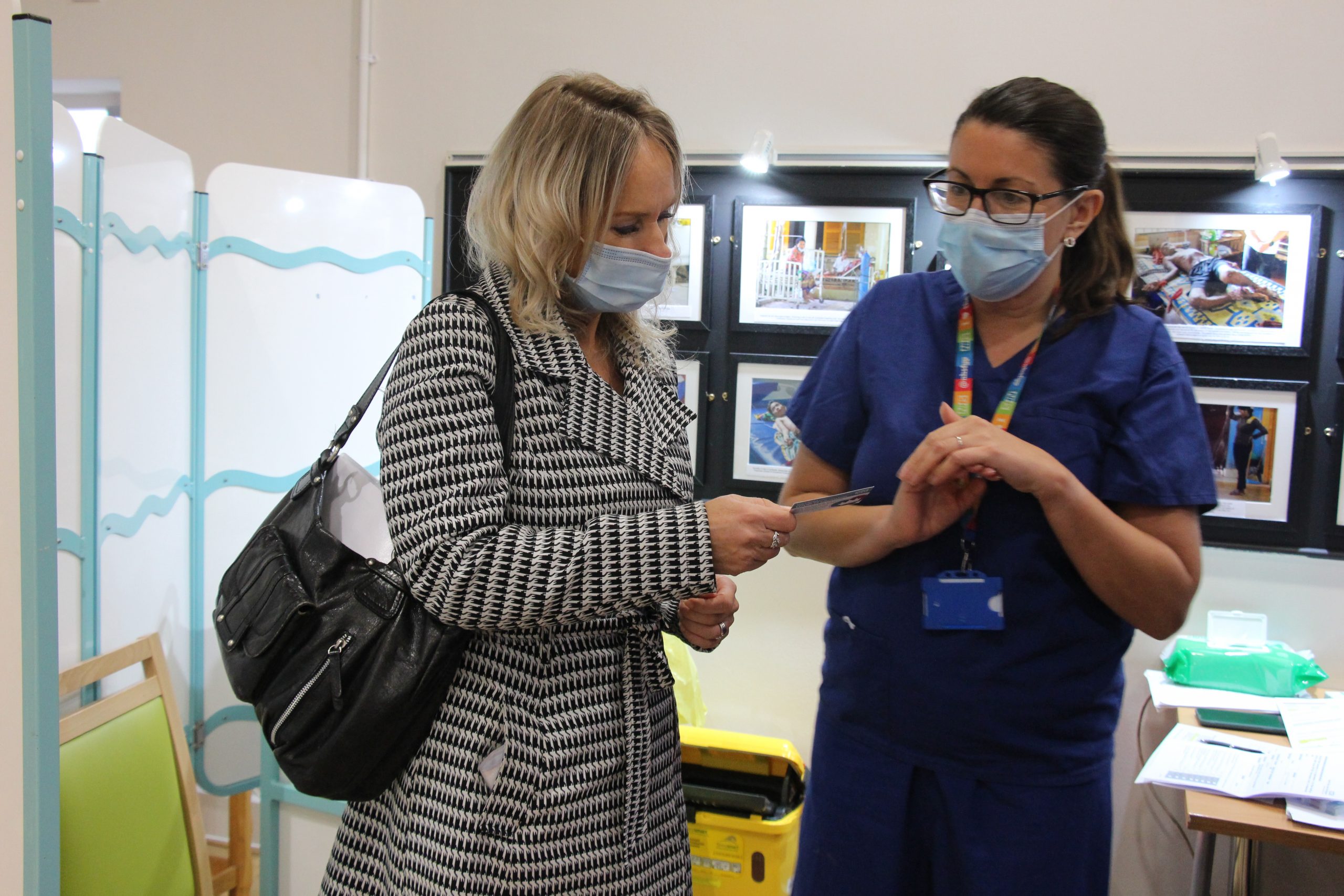 Michelle receiving information about vaccines from her vaccinator.