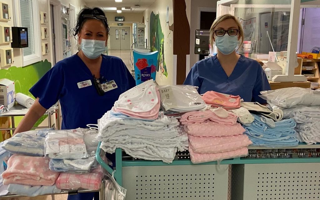 Jayne Jobling and Zoe Kitching with clothing donated by Lisa.