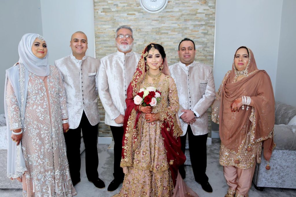The Farooq family at a family wedding.,