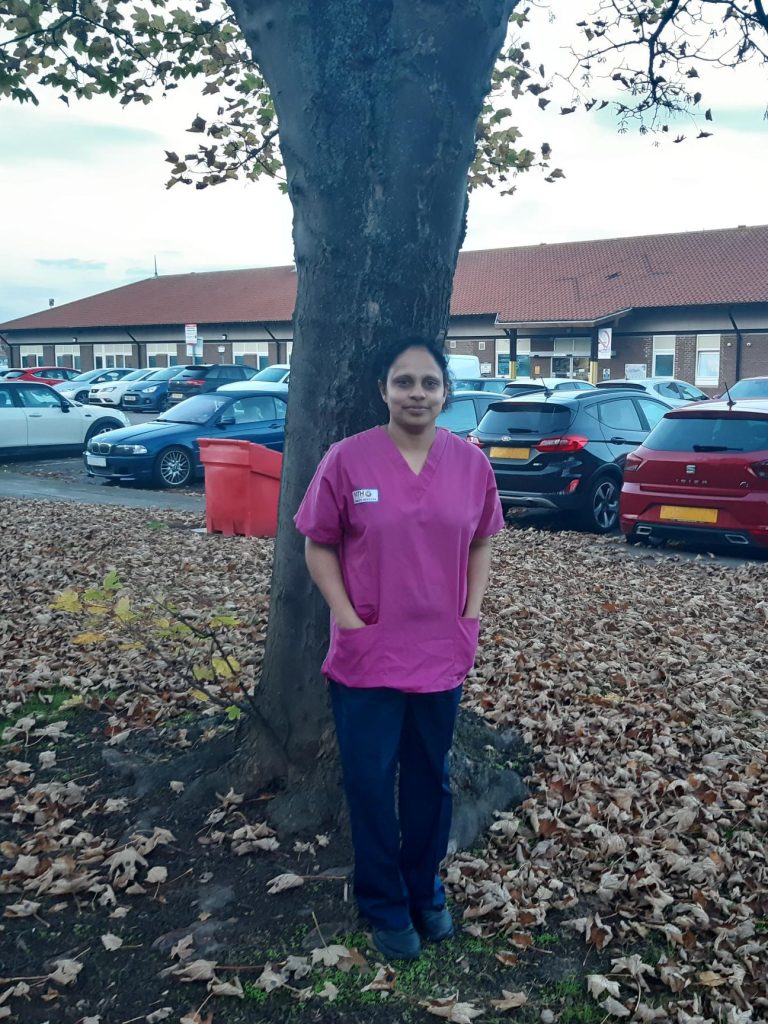 Ganga Patabandige in her domestic's scrubs.
