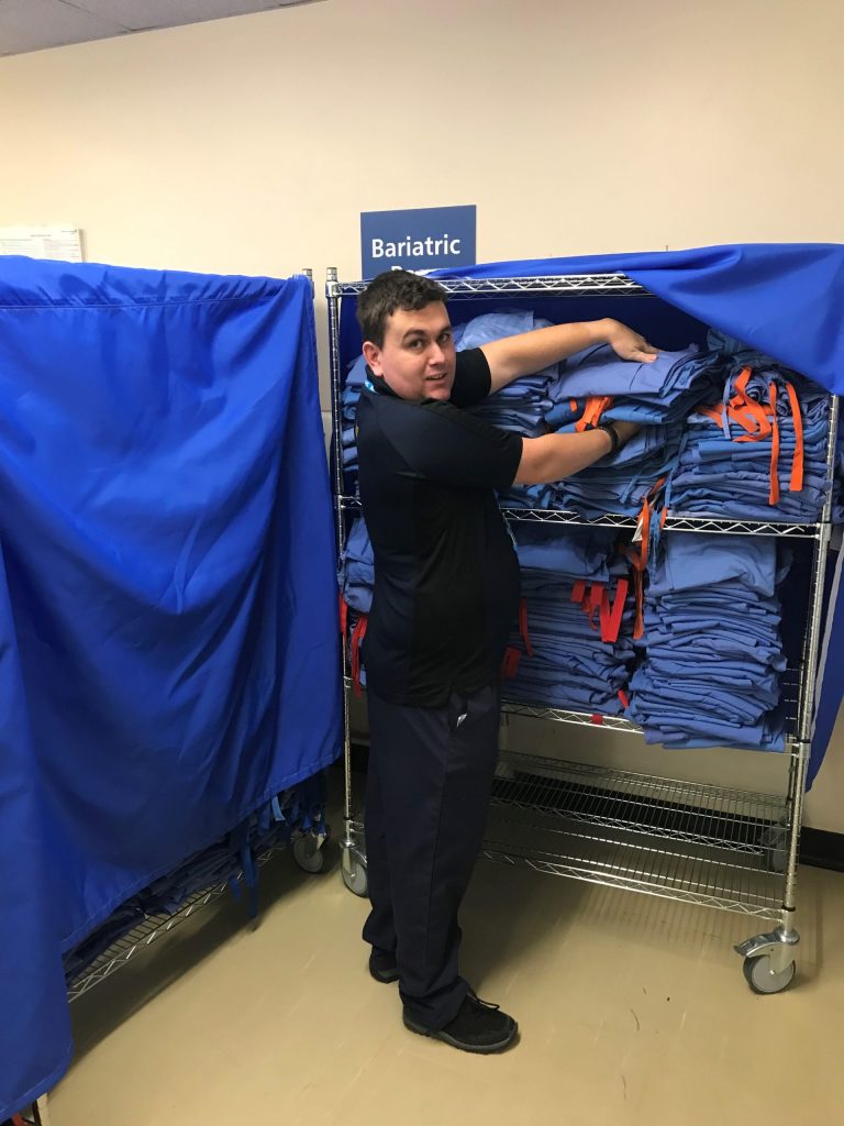 Gareth Orr organising linens.