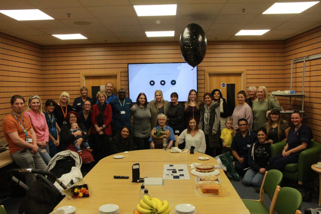 Sue with a large group of her colleagues at the Trust.