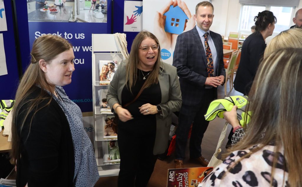 Exhibitors talking to members of staff.