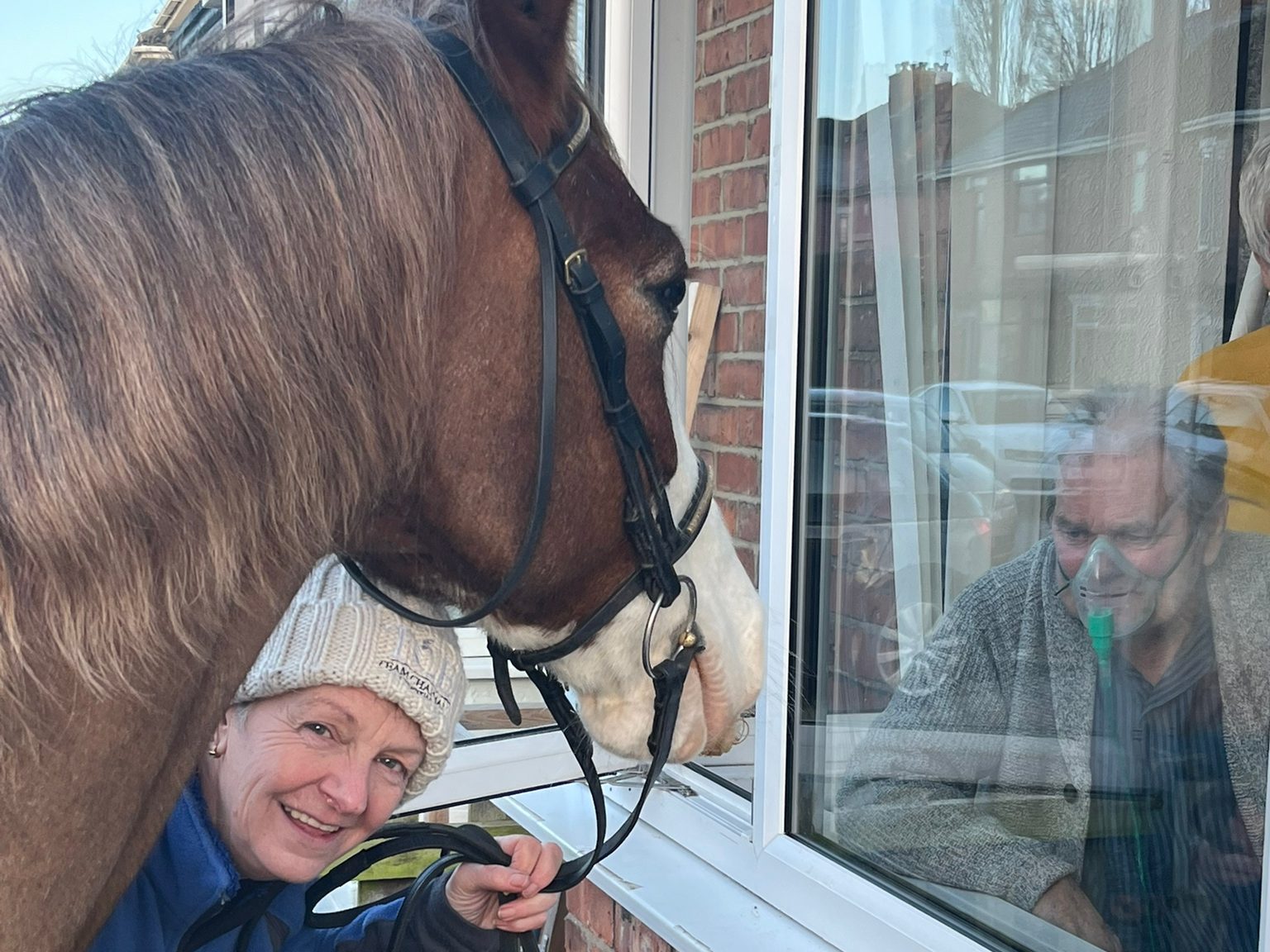 Debra outside Terry's house with Mr Riley.
