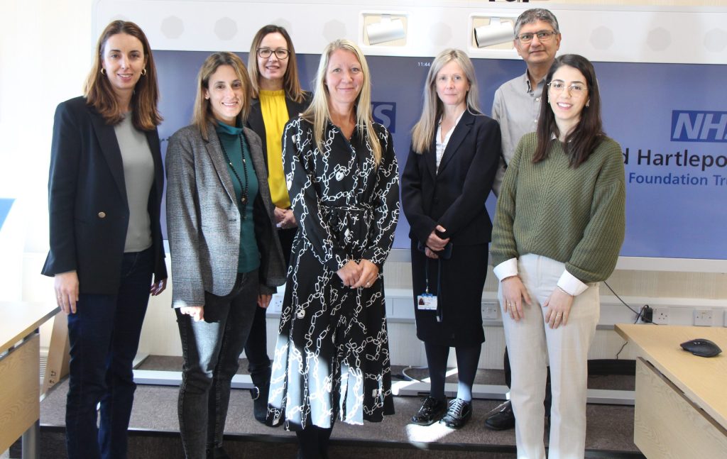 A group photo of visitors with senior leaders in the Trust.