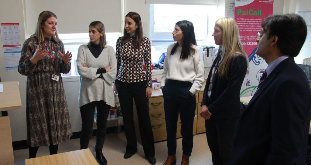 Visitors from Israel speak with a member of staff.