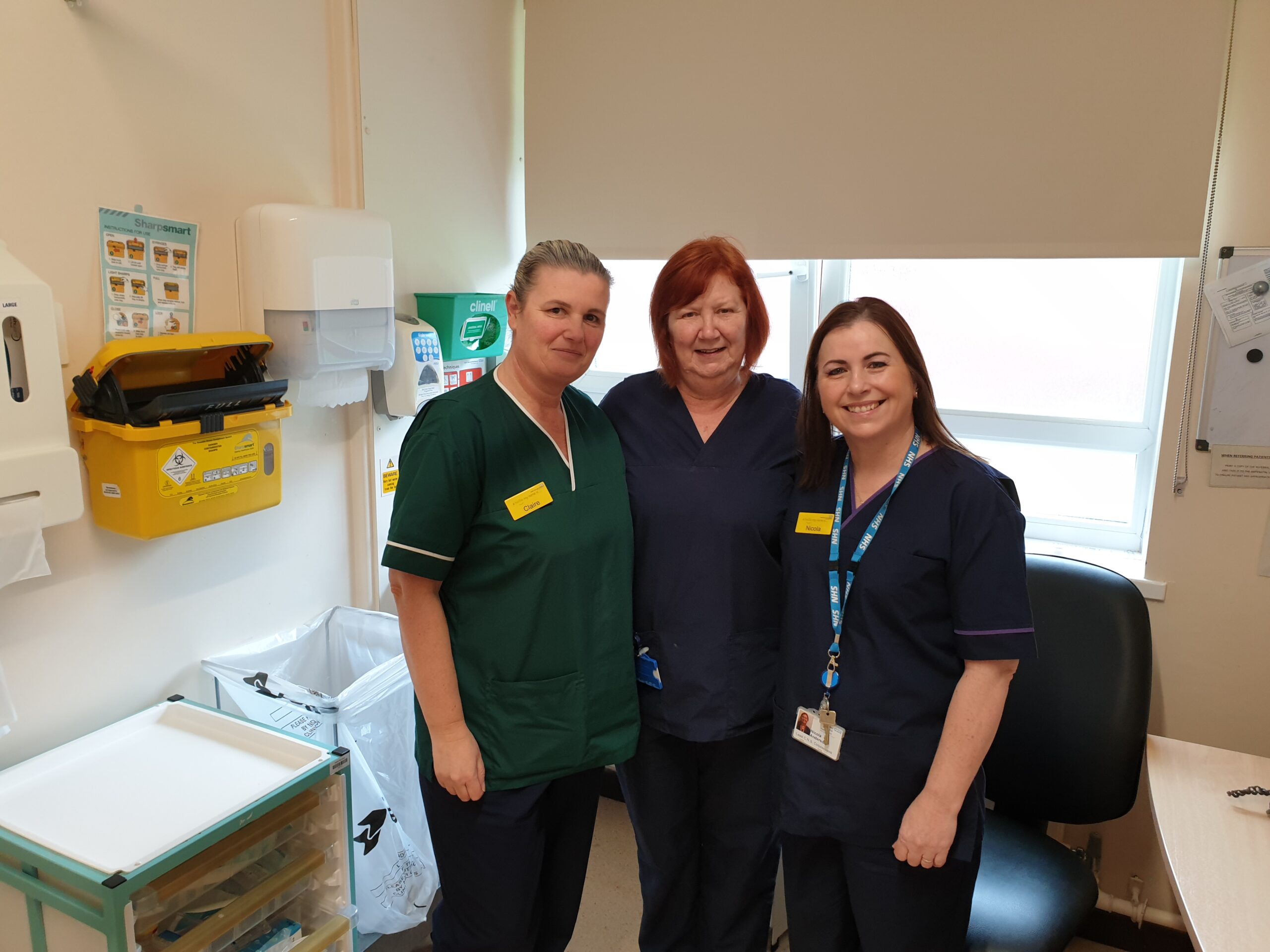 Cervical screening team with patient
