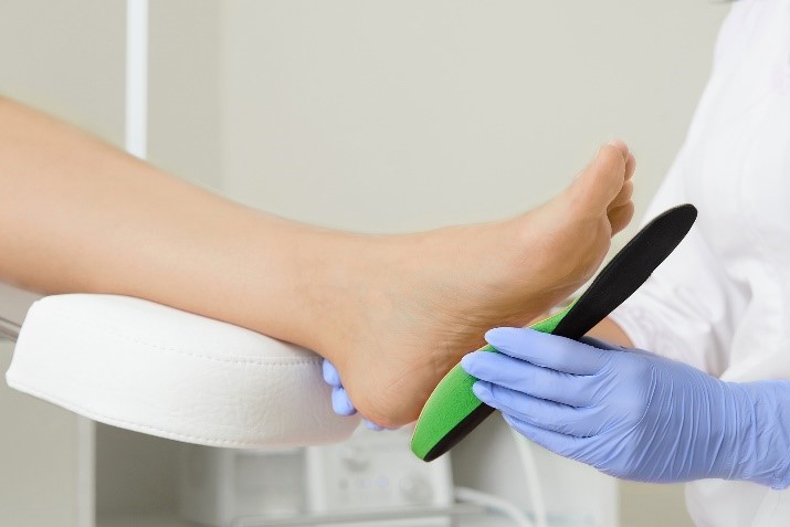 insole being measured to foot