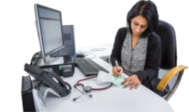 doctor writing at their computer