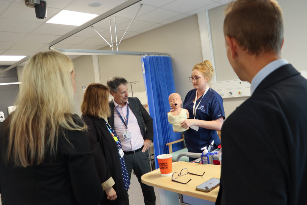 Academy staff showcasing some of the new equipment and facilities on offer at the Health and Social Care Academy