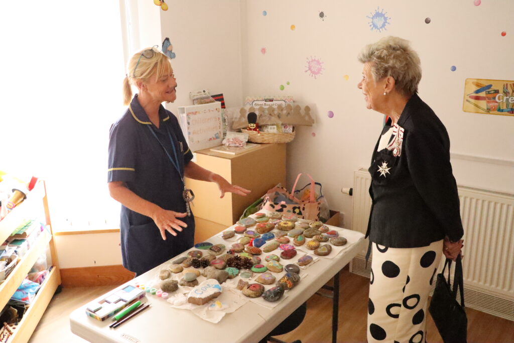 Staff talking to VIP guest during hospice tour.