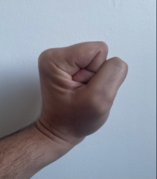 A hand clenched.