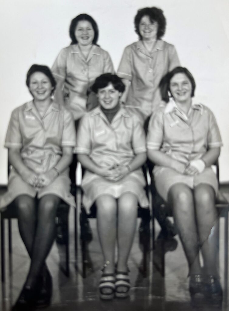 Karen (bottom left) in her ward hostess uniform