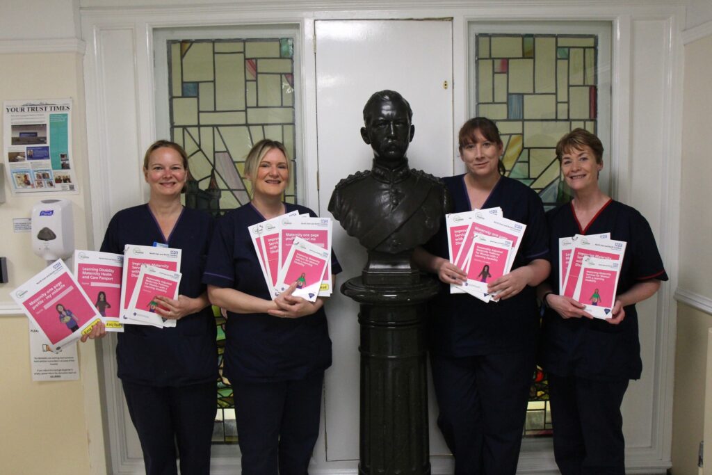 Complex needs midwives hold information packs.