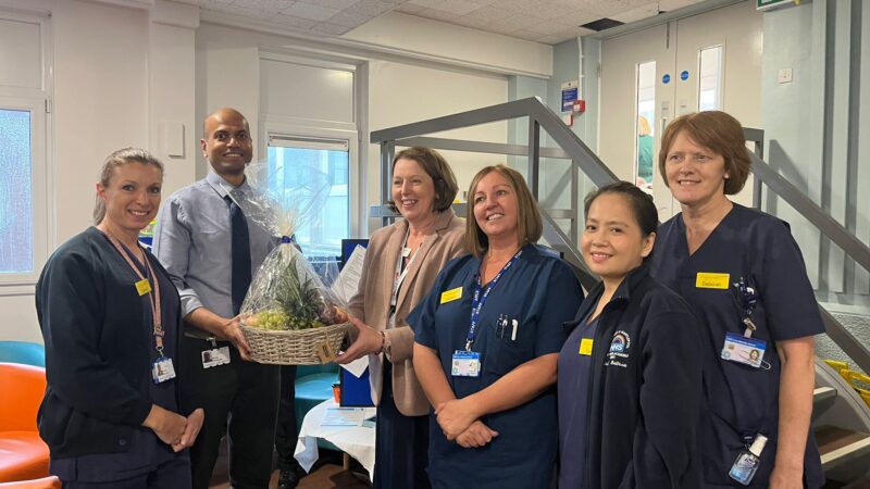 Day-case team stand with award