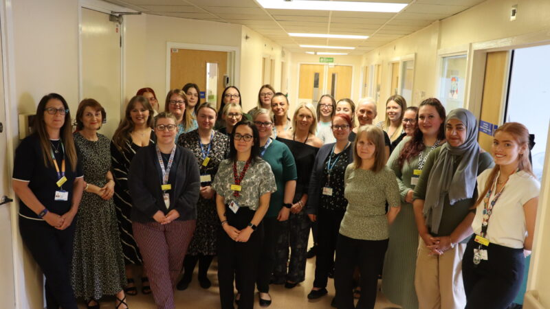 Support team standing in a corridor in Hartlepool.