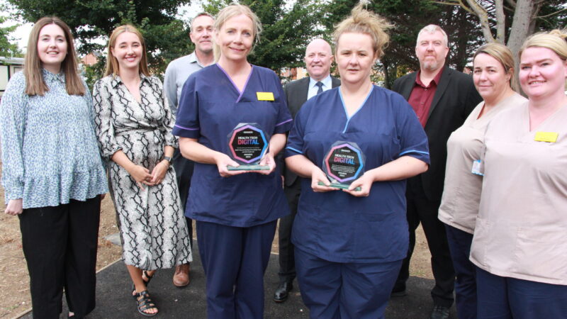 The Health Tech Award winners - a group of staff with the trophies