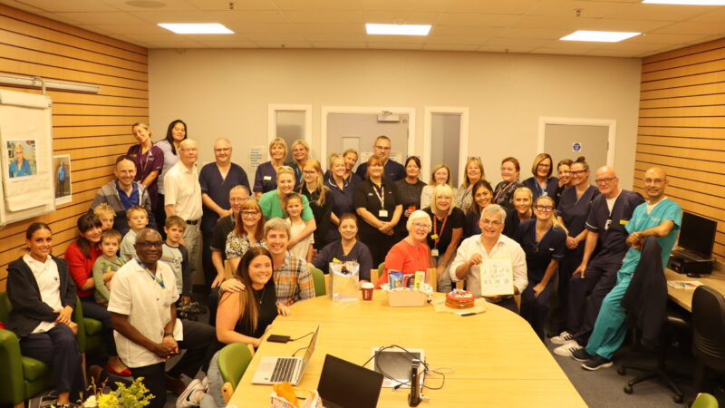 Emergency care team thank senior doctor at leaving event.