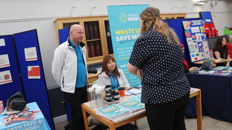 Staff speak with stallholders.