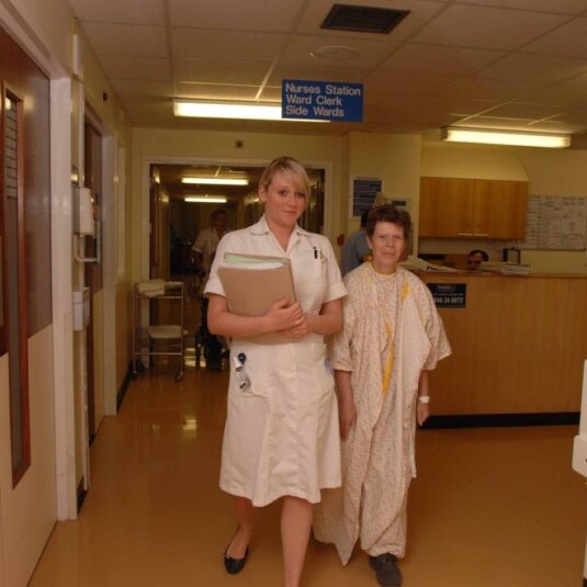 Staff member and patient walk to x-ray appointment
