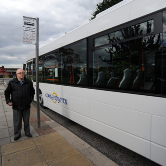 Patient waits for a bus to get to hospital