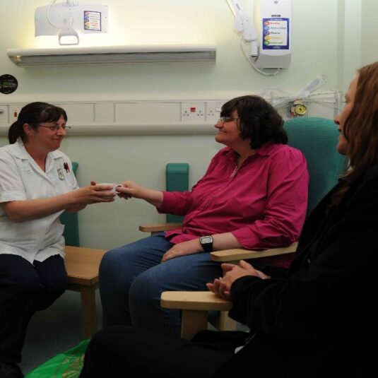 Patient is given a cup of tea in discharge lounge