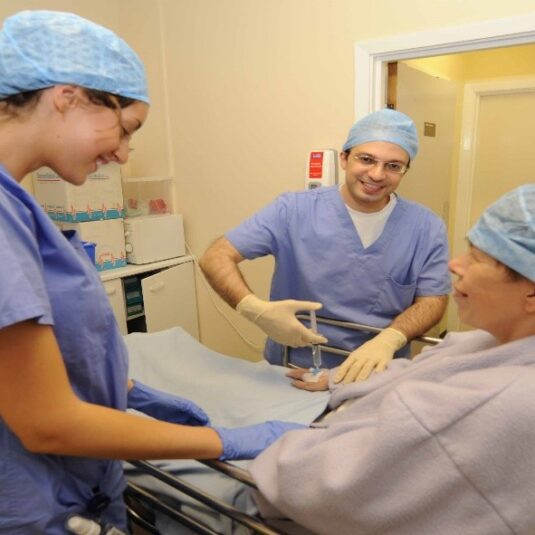 Anaesthetists administer drugs to put patient to sleep