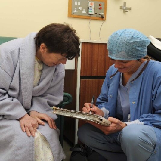Theatre staff go through consent process with a patient