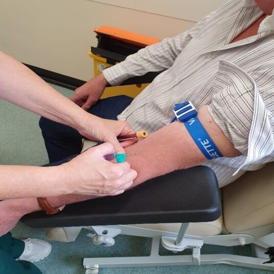 Patient getting blood test done.