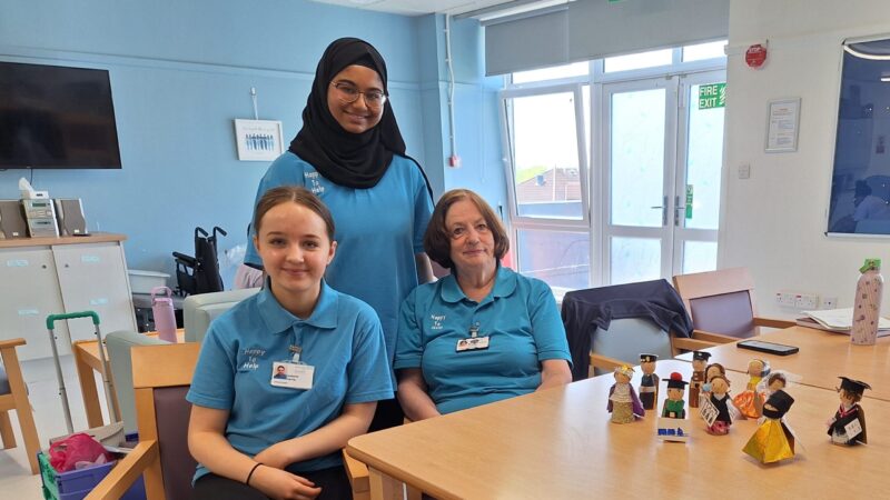 Volunteers with artwork.