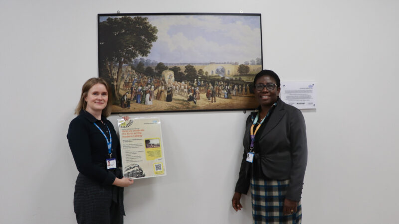 Public health consultant Esther and arts council member Katherine in front of the dobbin image.