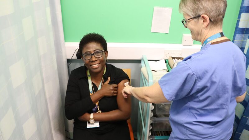 Doctor getting flu vaccine.