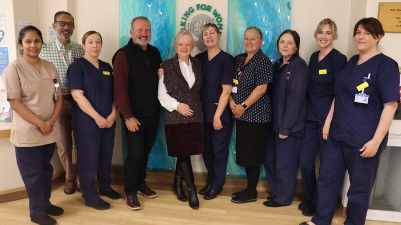 Julie and Alan Tyerman (centre) with members of the breast unit team.