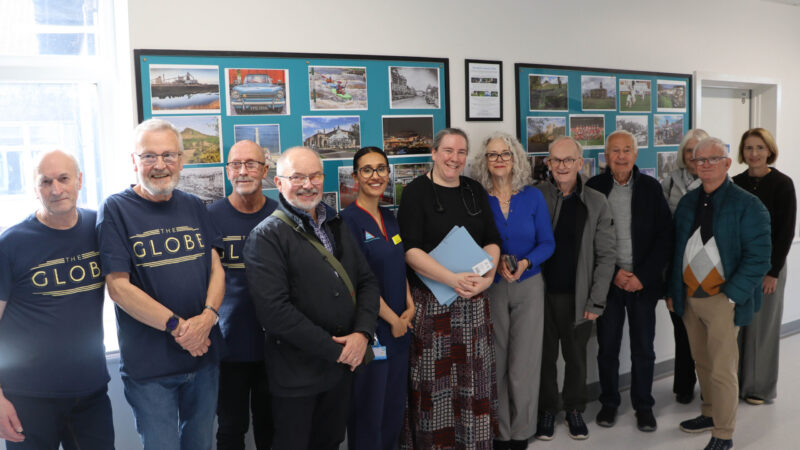 Volunteers from the globe and the Stockton Camera Club at the unveiling of the new displays.
