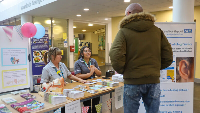 Members of the audiology team help direct patients to the department open day
