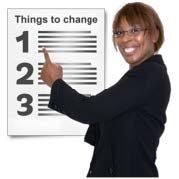 Woman points at a paper that is talking about things to change in patient care