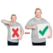 Man holding up tick and cross signs