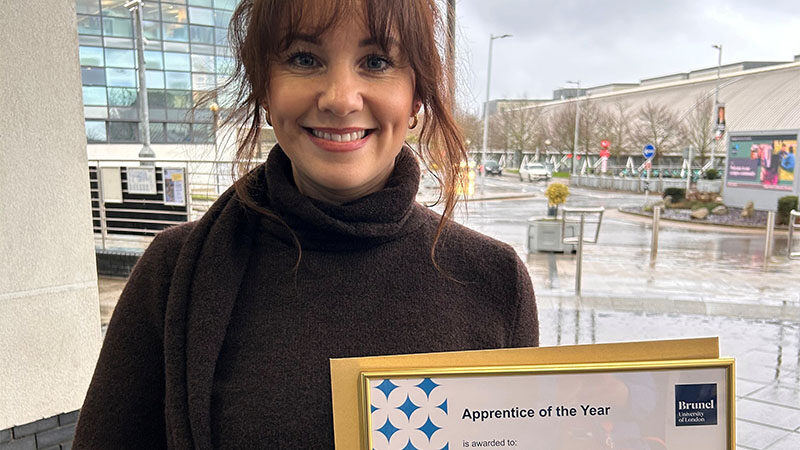 Natasha McManus holding her apprentice of the year award