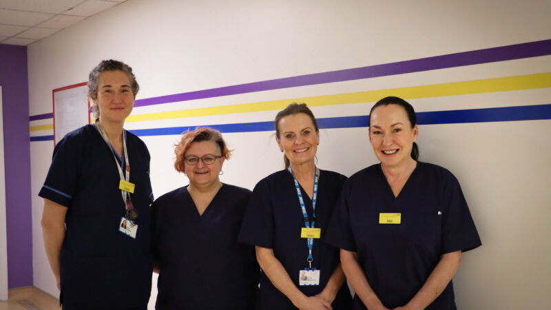 Podiatry team having photo taken during a patient clinic.