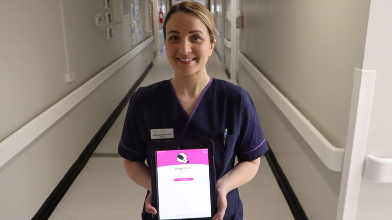 Laura Stephenson, specialist midwife, displays the Badger Notes app