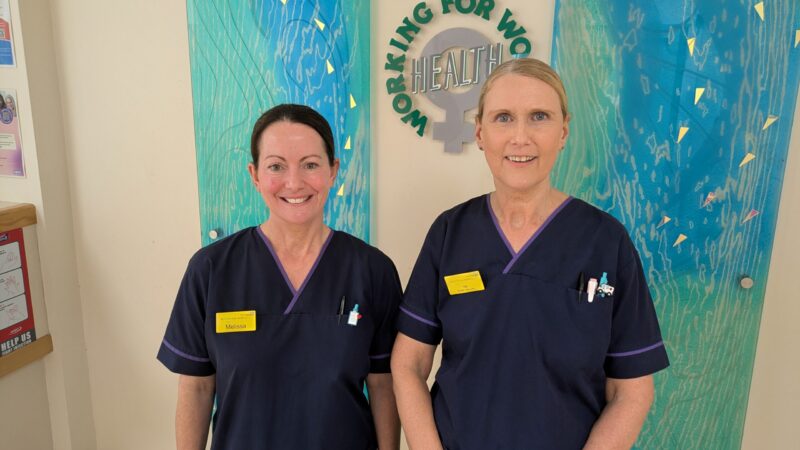 Breast care nurses standing in the main reception area.