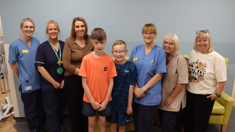 Jude, Luca and their teaching assistants with staff in the chemotherapy unit.