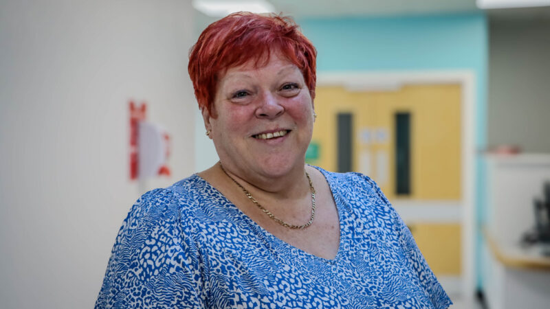 Janet Alderton standing in a corridor