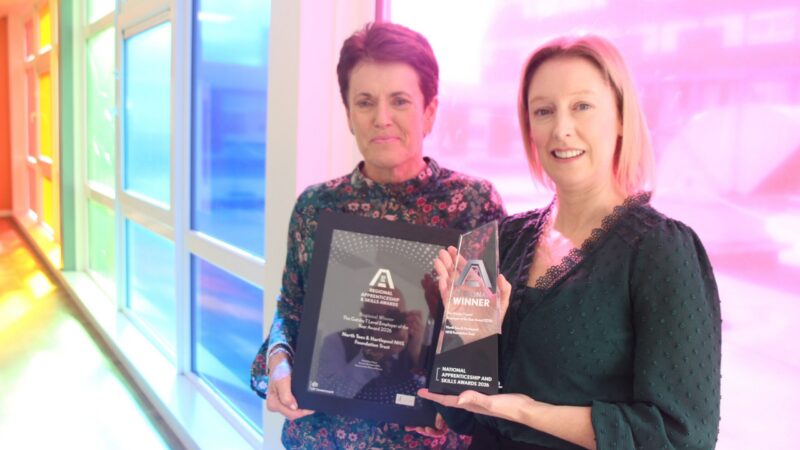 Alison Parker and Emma Davies with the winner’s trophy and certificate