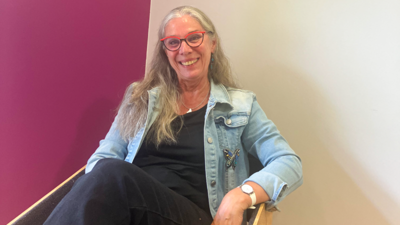 Fi Oakes sits on a chair.