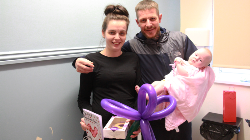 Kennedy and David with their gifts. David is holding baby Ivy.