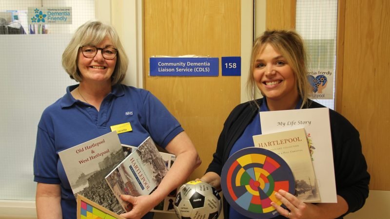 Community dementia specialist nurses, Laura Greig and Janette McGuire, photographed with library equipment