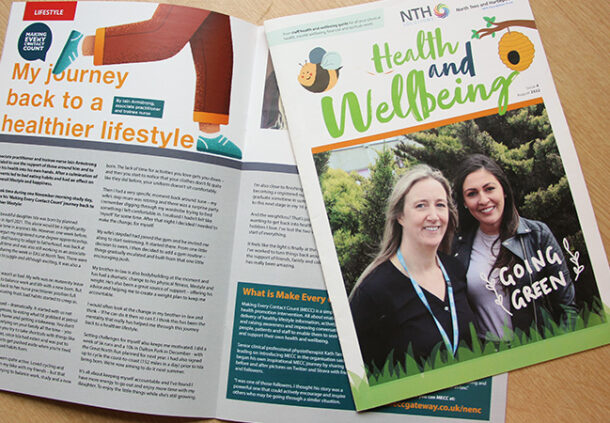 Health and wellbeing magazine laid out on table.